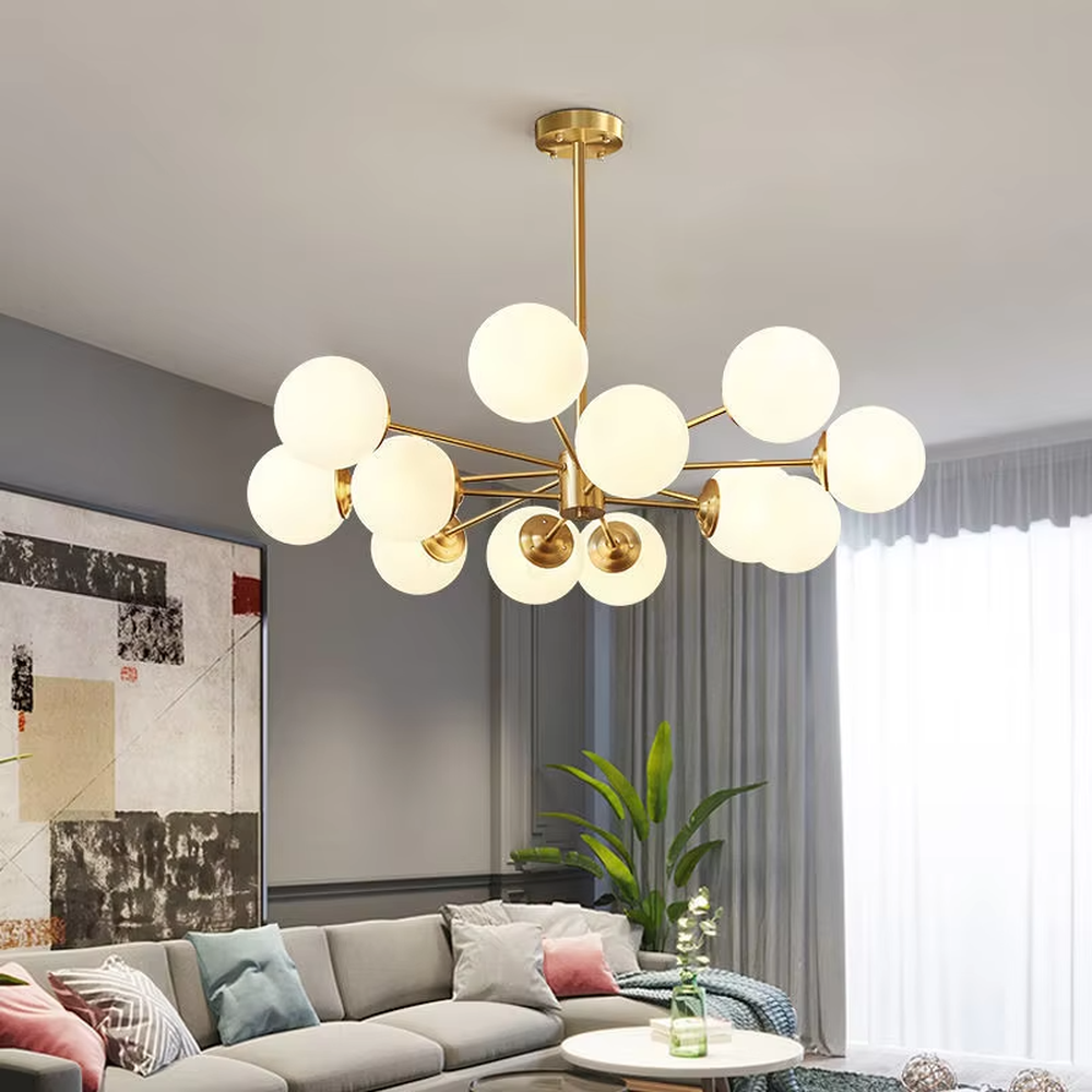 Modern light luxury magic bean chandelier, featuring a radial frame in black and gold metal paired with milk-white frosted glass ball lampshades. Its minimalist, rounded, and layered design combines warmth and style, making it a decorative lighting fixture that enhances the space's texture.