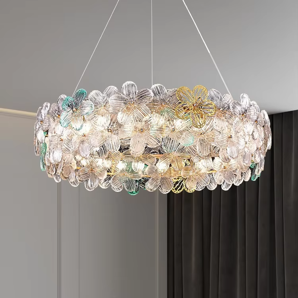 This modern French-style linear petal chandelier features a gold metal ceiling base, with transparent glass petals arranged in a fluffy linear layout with delicate textures. When lit, it emits a soft and gentle glow, combining a romantic ambiance with an ethereal feel. Ideal for dining rooms, bars, bedrooms, and other spaces, it adds a dreamy and exquisite touch to modern minimalist or French light luxury home environments.