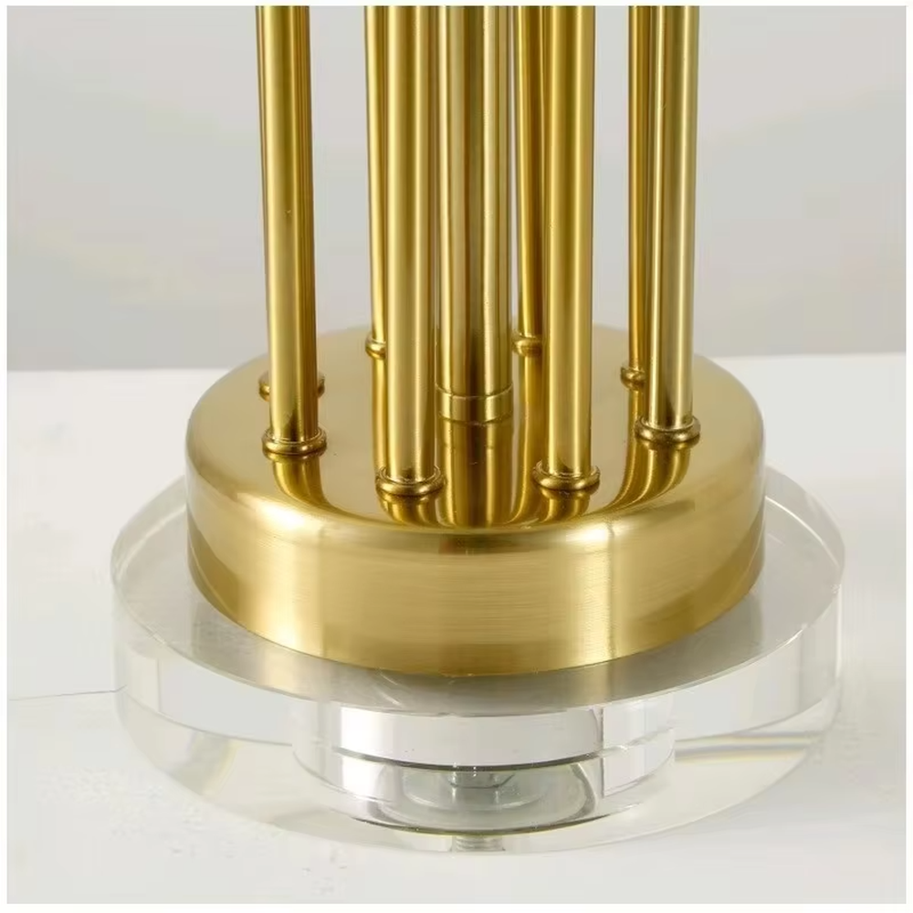 This is a modern luxury-style table lamp with a golden metal stand, multiple spherical decorations, and a beige fabric lampshade that transmits light softly. It has an exquisite and layered design. It is used for local desktop lighting and decoration, combining practicality and aesthetics. It is suitable for modern home living room side tables, bedroom bedside tables, as well as high-end hotel guest rooms, luxury cafes and other places.