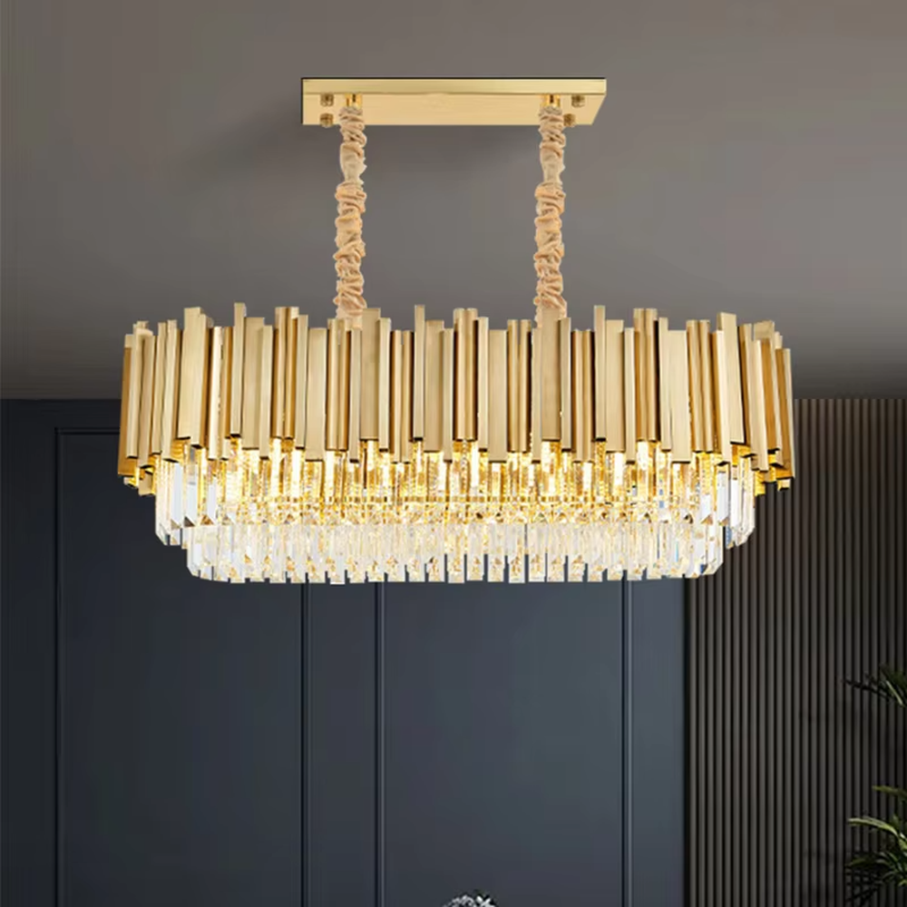 This modern light luxury two-layer square chandelier features a gold metal strip frame on the upper layer and dense, transparent long crystals hanging below. When lit, light refracts through the crystals to emit a brilliant and soft glow, combining a luxurious texture with an ambient atmosphere. Ideal for living rooms, dining rooms, light luxury apartments, and other spaces, it adds an exquisite and sophisticated touch to modern minimalist or light luxury home environments.