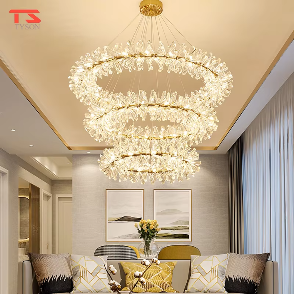 This modern light luxury two-layer circular chandelier features a gold metal frame, inlaid with transparent snowflake-shaped crystal modules, combined into a two-layer staggered circular shape. When lit, light refracts through the crystal to emit a brilliant and soft glow, combining an ethereal feel with an ambient atmosphere. Ideal for living rooms, dining rooms, light luxury apartments, and other spaces, it adds a dreamy and exquisite touch to modern minimalist or French light luxury home environments.