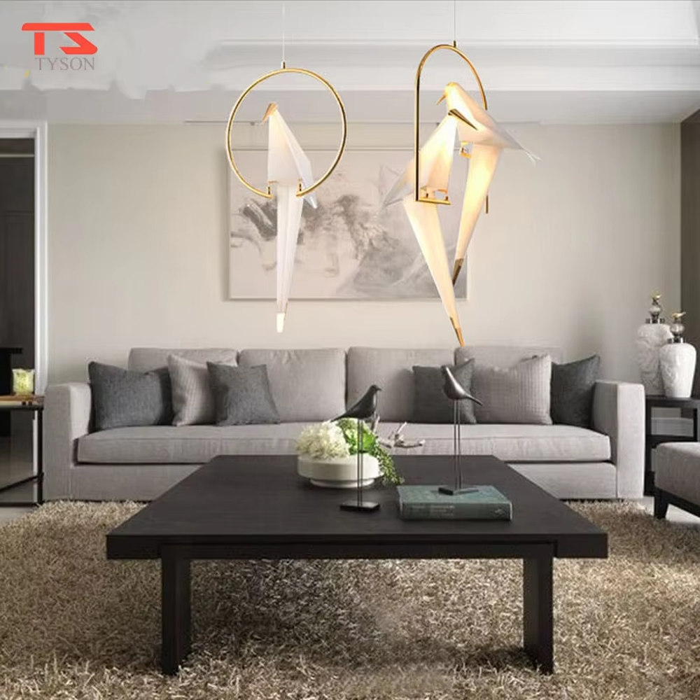 Modern art origami crane cage chandelier, featuring an arched gold metal frame paired with a white origami crane lampshade made with paper folding techniques. Its elegant and dynamic lines combine artistry and ambiance, making it a decorative lighting fixture that elevates the space's style.