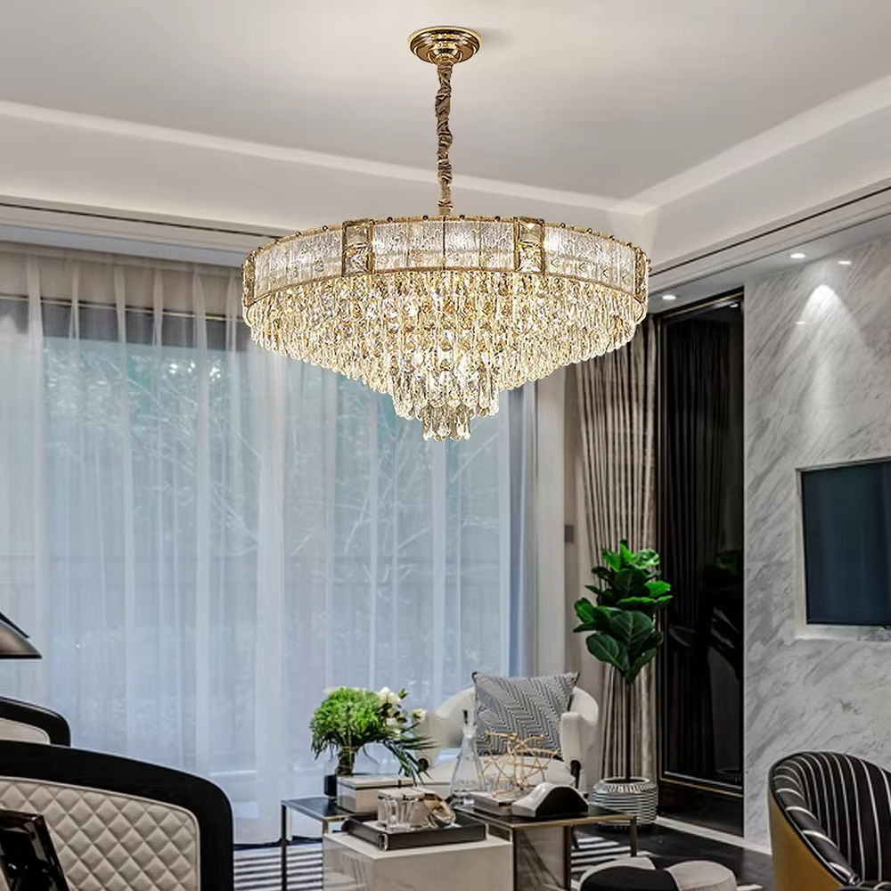This light luxury and grand two-layer crystal chandelier features a gold metal frame with vertical-textured glass lampshades on the upper layer, and multiple layers of transparent crystal tassels hanging below, creating a full dome shape. When lit, light refracts through the crystal to emit a brilliant and soft glow, combining elegant texture with an ambient atmosphere. Ideal for bedrooms, living rooms, dining rooms, and other spaces, it adds an elegant and exquisite touch to European light luxury or modern minimalist home environments.
