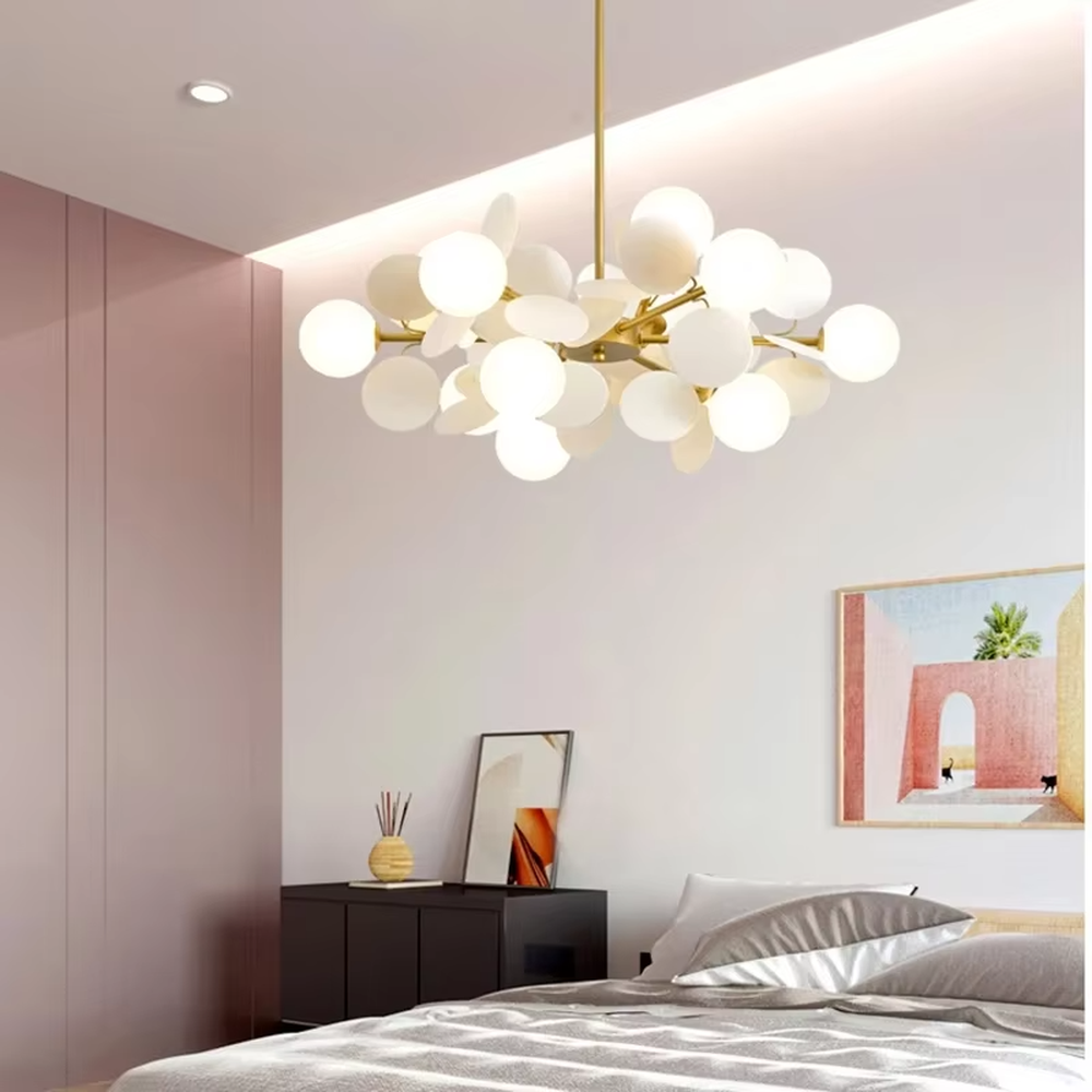 This playful and colorful disc chandelier features a gold metal frame, paired with milky white glowing spheres and macaron-colored (pink, orange, blue, yellow) decorative discs arranged in a staggered layout. When lit, it emits a soft and warm glow, creating a lively and comforting atmosphere. Ideal for kids' bedrooms, parent-child play areas, kindergartens, and other spaces, it adds a dreamy and romantic touch to childlike environments.