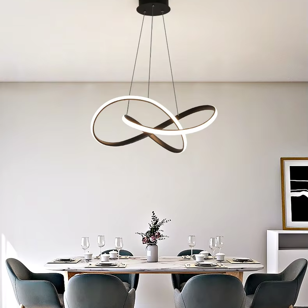 Modern light luxury interlocking double-ring chandelier, featuring a fluid interwoven ring structure in black and gold metal with built-in soft LED lighting. Its dynamic and elegant lines combine style and ambiance, making it a modern home lighting fixture that elevates the space's aesthetic.