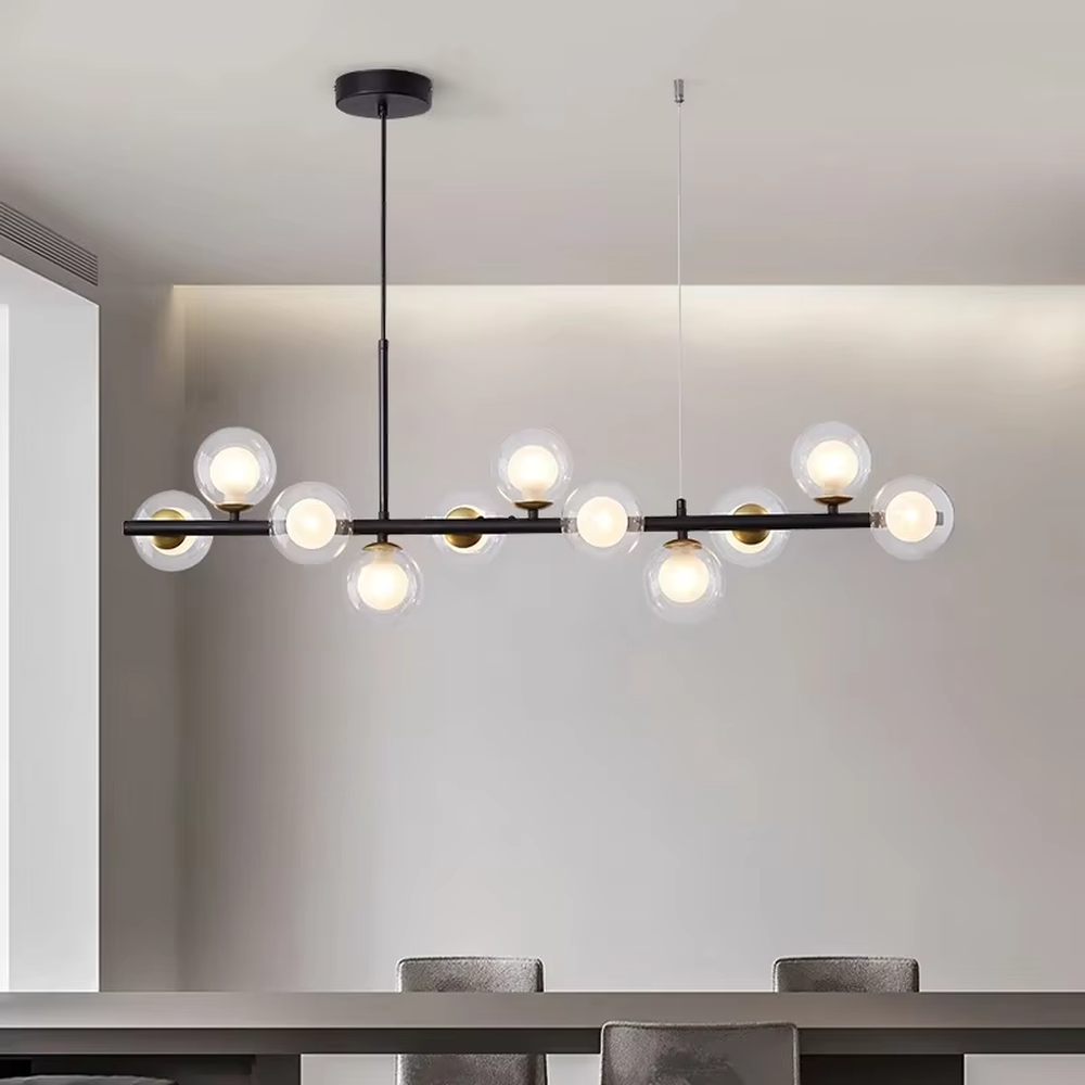 Modern light luxury gradient glass ball linear chandelier, featuring a black metal frame paired with gradient smoky gray glass ball lampshades. Its minimalist and layered design combines style and ambiance, making it a decorative lighting fixture that elevates the space's aesthetic.