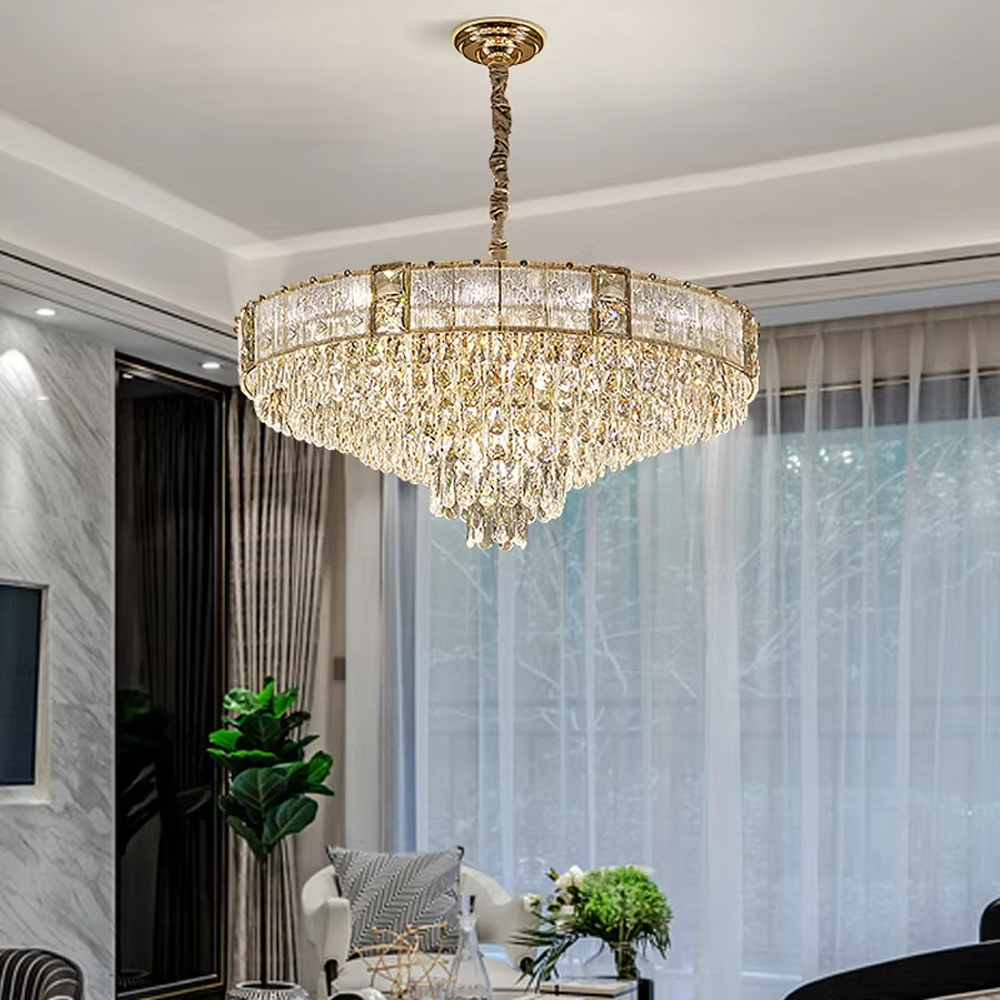 This light luxury and grand multi-layer conical crystal chandelier features a gold metal frame, with vertical-textured glass lampshades on the upper layer and multiple layers of transparent crystal tassels hanging below, creating a full conical shape. When lit, light refracts through the crystal to emit a brilliant and luxurious glow, combining elegant texture with an ambient atmosphere. Ideal for living rooms, dining rooms, villa high-ceiling spaces, and other areas, it adds an elegant and exquisite touch to European light luxury or modern luxury home environments.