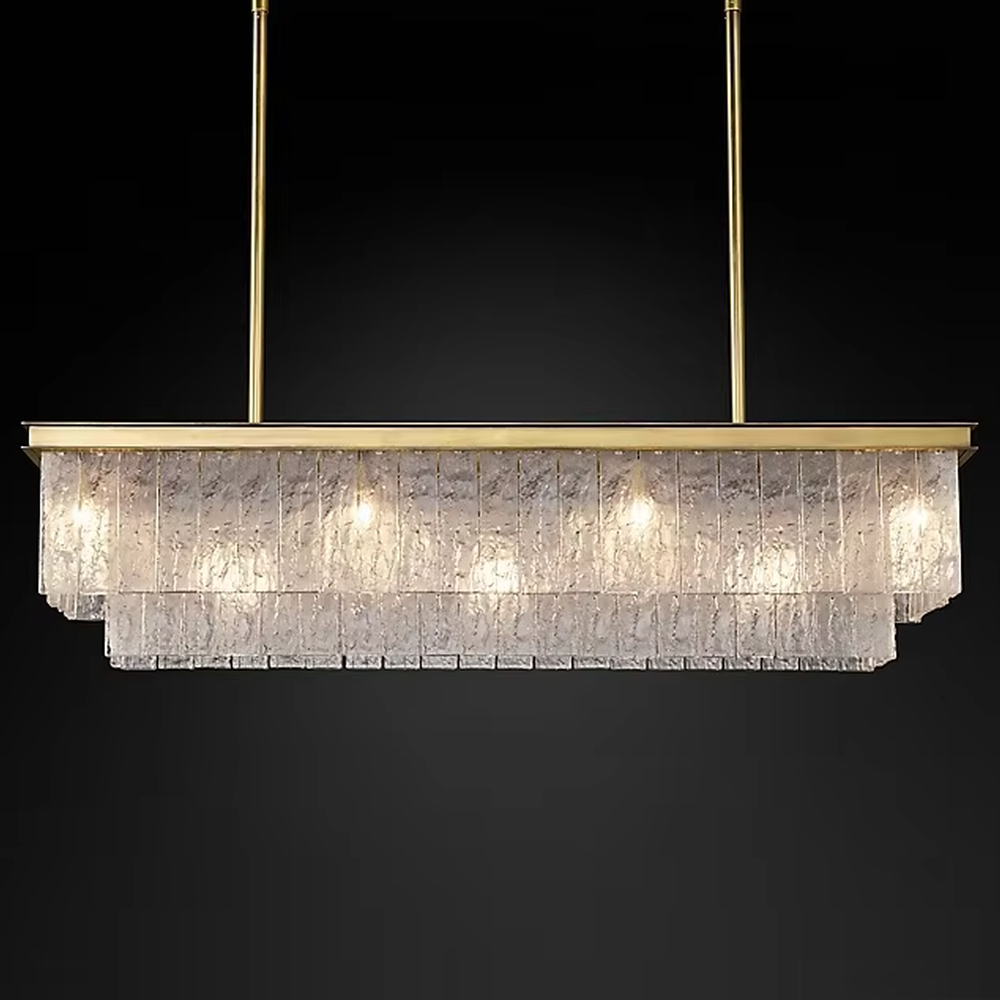 This modern light luxury layered conical chandelier features a gold metal top frame, with multiple layers of textured glass strips hanging down to form a conical layered shape. When lit, light refracts through the glass to emit a brilliant and soft glow, combining a luxurious texture with an ambient atmosphere. Ideal for high-ceiling living rooms, villas, light luxury apartments, and other spaces, it adds an exquisite and sophisticated touch to modern minimalist or light luxury home environments.
