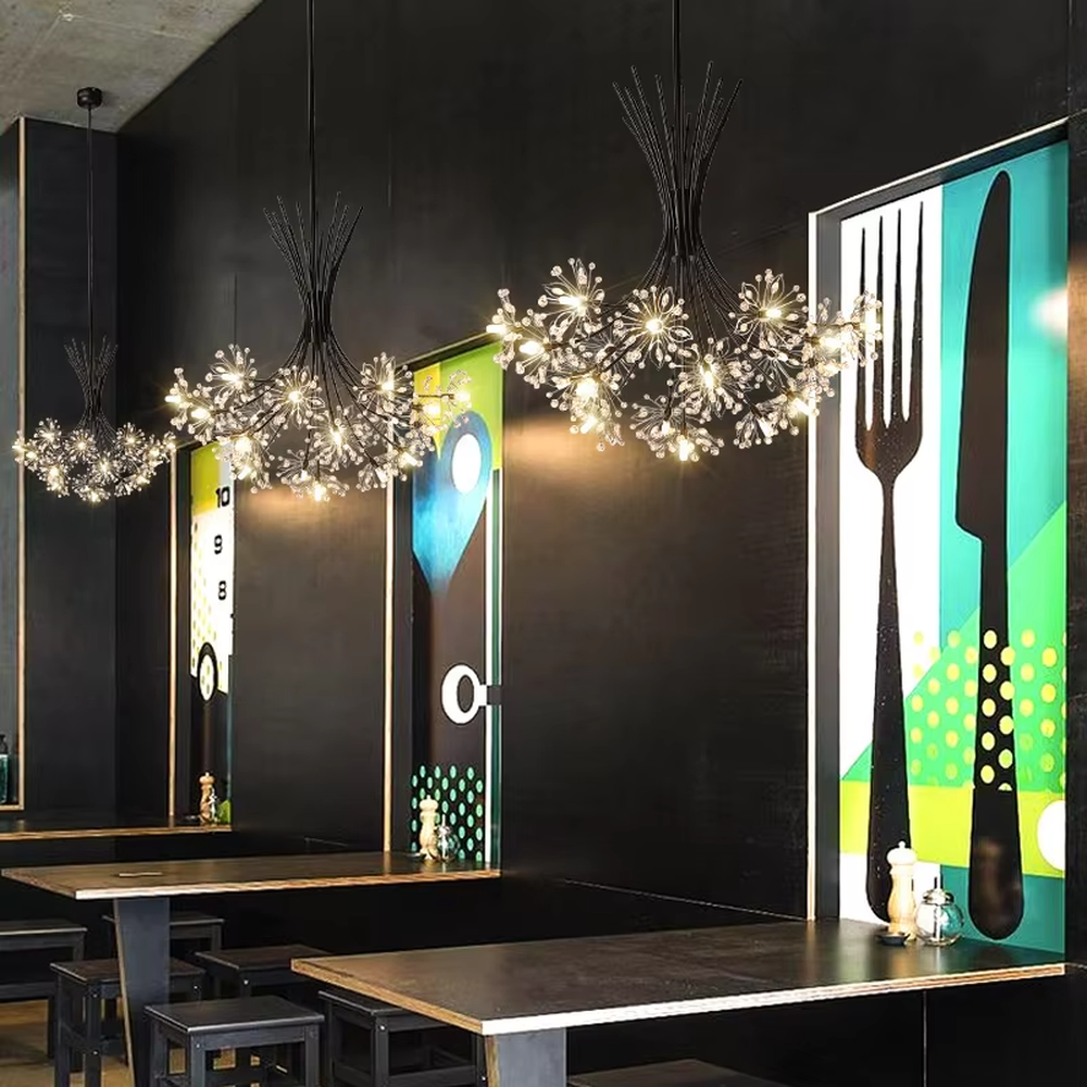 This modern light luxury dandelion-shaped chandelier features a black wrought iron frame and transparent crystal flower ball lampshades. When lit, it emits a bright and soft glow like blooming fireworks, combining decorative appeal with an ambient atmosphere. Ideal for bedrooms, living rooms, dining rooms, and other spaces, it adds an exquisite and romantic touch to modern minimalist, light luxury, or Nordic-style home environments.