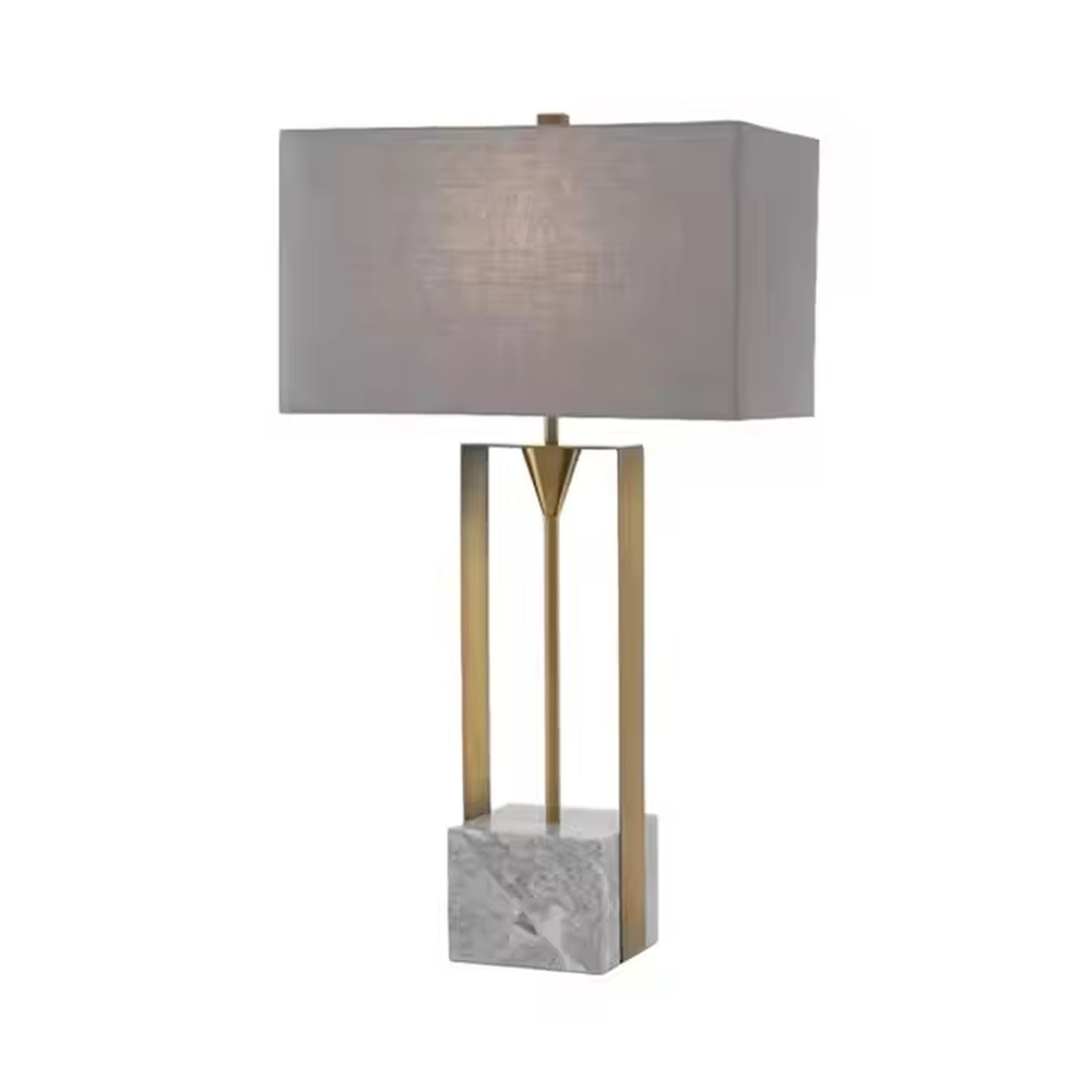 This is a modern minimalist table lamp with a golden metal frame, a marble base, and a gray fabric square lampshade, featuring a simple and elegant design. It is used for local desktop lighting and decoration, combining practicality and aesthetics. It is suitable for modern home living room side tables, bedroom bedside tables, high-end hotel guest rooms, luxury office spaces and other places.