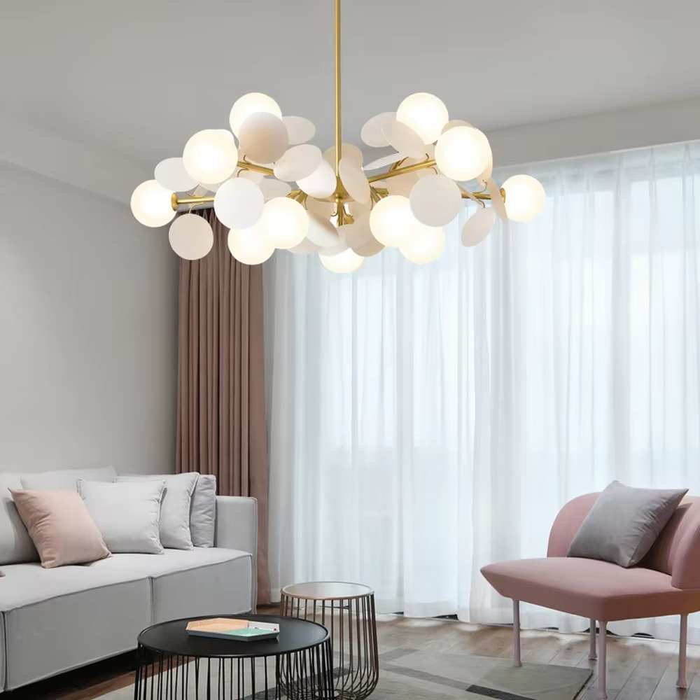 This playful and colorful disc chandelier features a gold metal frame, paired with milky white glowing spheres and macaron-colored (pink, orange, blue, yellow) decorative discs arranged in a staggered layout. When lit, it emits a soft and warm glow, creating a lively and comforting atmosphere. Ideal for kids' bedrooms, parent-child play areas, kindergartens, and other spaces, it adds a dreamy and romantic touch to childlike environments.