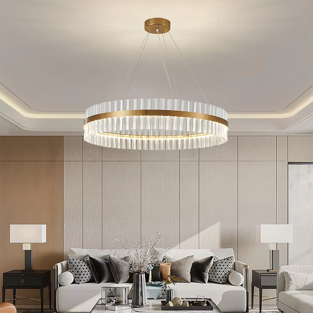 This modern light luxury circular crystal chandelier features a gold metal frame, inlaid with transparent long crystals to form a double-layered circular shape. When lit, light refracts through the crystal to emit a brilliant and soft glow, combining an exquisite texture with an ambient atmosphere. Ideal for living rooms, dining rooms, light luxury apartments, and other spaces, it adds an exquisite and sophisticated touch to modern minimalist or light luxury home environments.