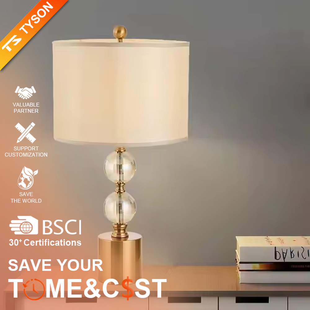This is a luxury-style table lamp with a golden base, transparent glass spherical body, and beige fabric lampshade. It features a simple and elegant design with excellent texture. It is used for local desktop lighting and decoration, creating a luxurious and warm ambiance. It is suitable for luxury-style home bedroom bedside tables, high-end hotel guest rooms, modern apartment living spaces and other places.