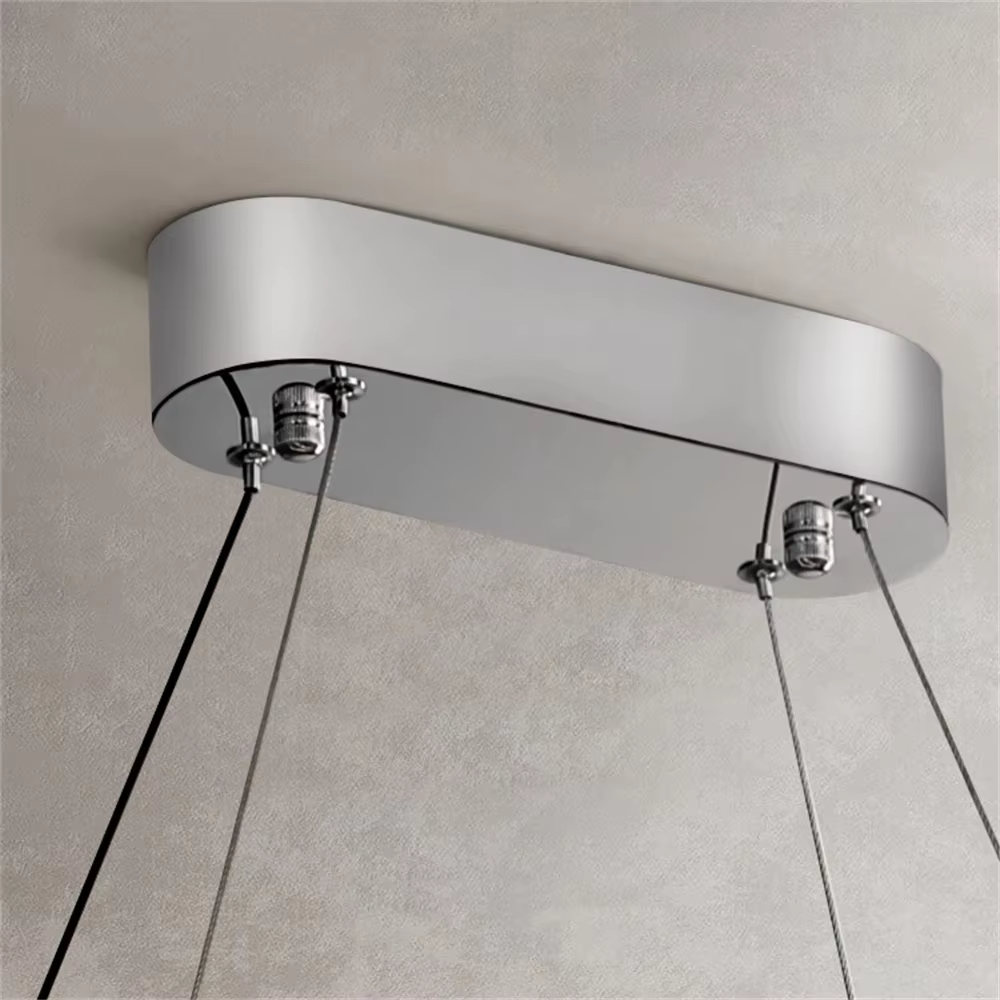 This modern light luxury double-ring interwoven crystal chandelier features a silver metal base, inlaid with transparent crystals to create a dynamic double-ring interwoven shape. When lit, light refracts through the crystal to emit a brilliant and dynamic glow, combining a futuristic feel with an ambient atmosphere. Ideal for living rooms, dining rooms, light luxury apartments, and other spaces, it adds an exquisite and sophisticated touch to modern minimalist or light luxury home environments.
