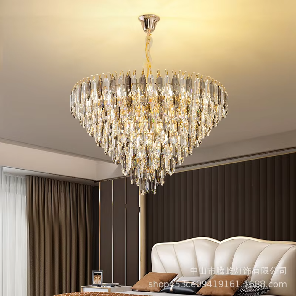 This modern light luxury layered crystal chandelier features a metal ceiling base, with multiple layers of transparent long crystal strips hanging down to form a full fan-shaped dome. When lit, light refracts through the crystal to emit a brilliant and luxurious glow, combining a luxurious texture with an ambient atmosphere. Ideal for living rooms, bedrooms, dining rooms, and other spaces, it adds an elegant and exquisite touch to modern light luxury or European luxury home environments.