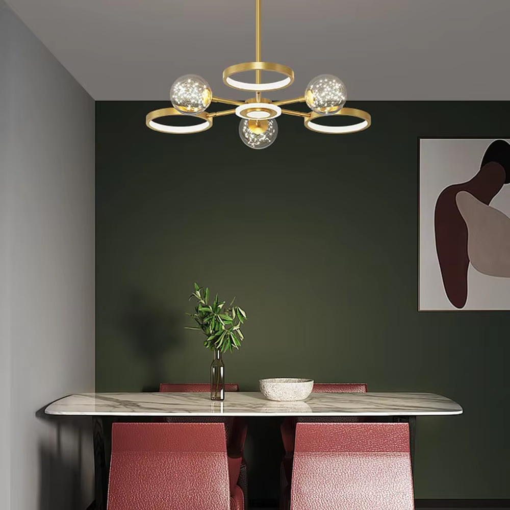 This modern light luxury radial chandelier features a gold metal frame with multiple radially extending arms, paired with glowing rings and glass ball lampshades with a starry sky effect. When lit, it emits a bright and soft glow, combining a futuristic feel with an ambient atmosphere. Ideal for living rooms, large apartments, and light luxury residences, it adds an exquisite and sophisticated touch to modern minimalist or light luxury home environments.