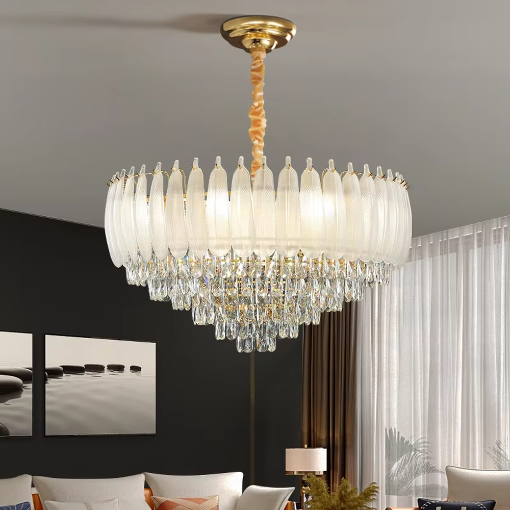 This light luxury retro two-layer chandelier features a dome shape enclosed by vertical-textured frosted glass on the upper layer, paired with hanging crystal tassels on the lower layer, all set in a gold metal frame. When lit, light refracts through the glass and crystal to emit a soft and brilliant glow, combining elegant texture with an ambient atmosphere. Ideal for dining rooms, bedrooms, light luxury living rooms, and other spaces, it adds an elegant and exquisite touch to European retro or modern light luxury home environments.
