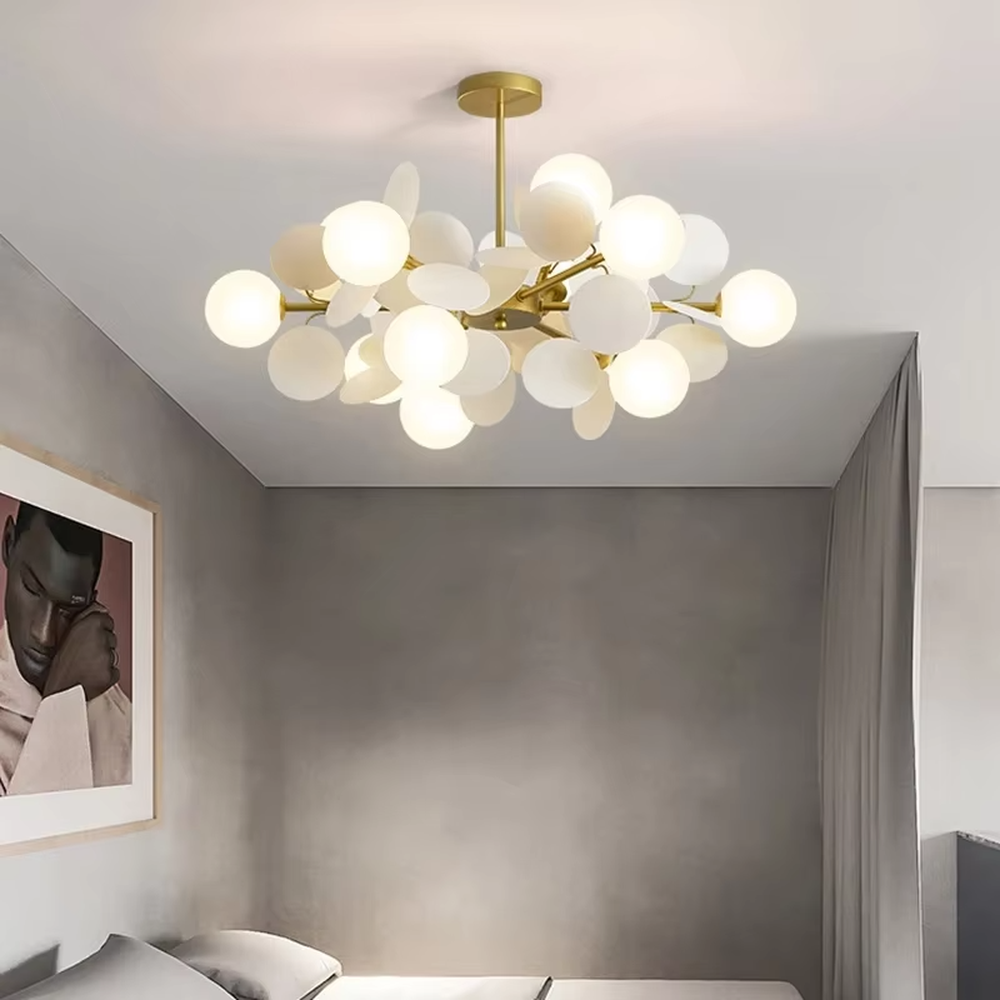 This playful and colorful disc chandelier features a gold metal frame, paired with milky white glowing spheres and macaron-colored (pink, orange, blue, yellow) decorative discs arranged in a staggered layout. When lit, it emits a soft and warm glow, creating a lively and comforting atmosphere. Ideal for kids' bedrooms, parent-child play areas, kindergartens, and other spaces, it adds a dreamy and romantic touch to childlike environments.