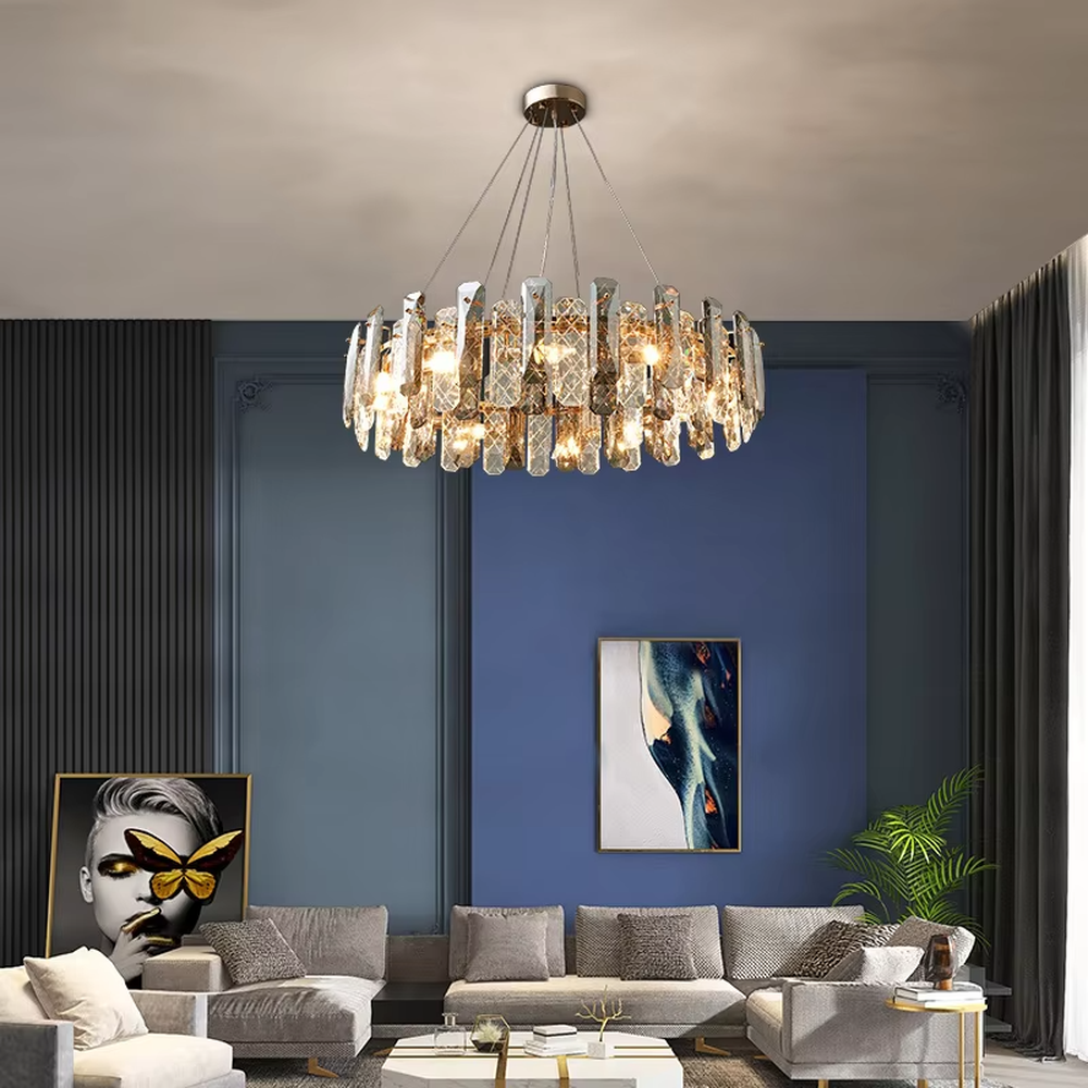 This modern light luxury circular crystal chandelier features a metal frame, inlaid with multi-faceted cut crystal pieces to form a rounded shape. When lit, light refracts through the crystal to emit a brilliant and luxurious glow, combining an exquisite texture with an ambient atmosphere. Ideal for living rooms, dining rooms, light luxury apartments, and other spaces, it adds an exquisite and sophisticated touch to modern minimalist or light luxury home environments.