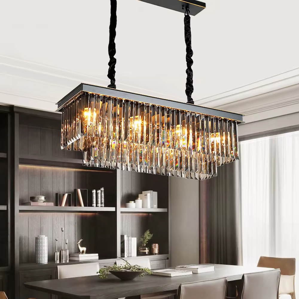 This modern light luxury circular crystal chandelier features a black metal frame, with dense transparent long crystals hanging down to form a full circular shape, suspended by a braided cord. When lit, light refracts through the crystal to emit a brilliant and soft glow, combining a bold texture with an ambient atmosphere. Ideal for living rooms, dining rooms, light luxury apartments, and other spaces, it adds an exquisite and sophisticated touch to modern minimalist or light luxury home environments.