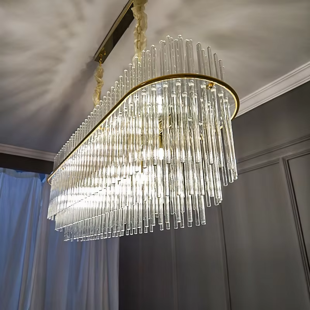 This modern light luxury multi-layer circular crystal chandelier features a gold metal frame, with multiple tiers of transparent long crystals hanging down to form a full circular shape, suspended by a gold chain. When lit, light refracts through the crystal to emit a brilliant and soft glow, combining a luxurious texture with an ambient atmosphere. Ideal for bedrooms, living rooms, light luxury apartments, and other spaces, it adds an exquisite and sophisticated touch to modern minimalist or light luxury home environments.