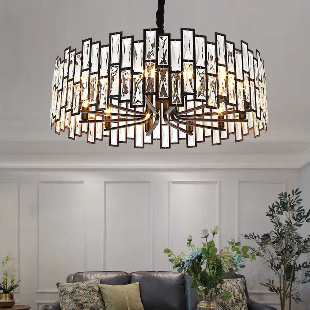 This modern light luxury square crystal chandelier features a black metal frame, inlaid with multi-faceted cut crystal pieces to form a square shape. When lit, light refracts through the crystal to emit a brilliant and luxurious glow, combining a bold texture with an elegant ambiance. Ideal for living rooms, dining rooms, large apartments, and other spaces, it adds an exquisite and sophisticated touch to modern minimalist or light luxury home environments.