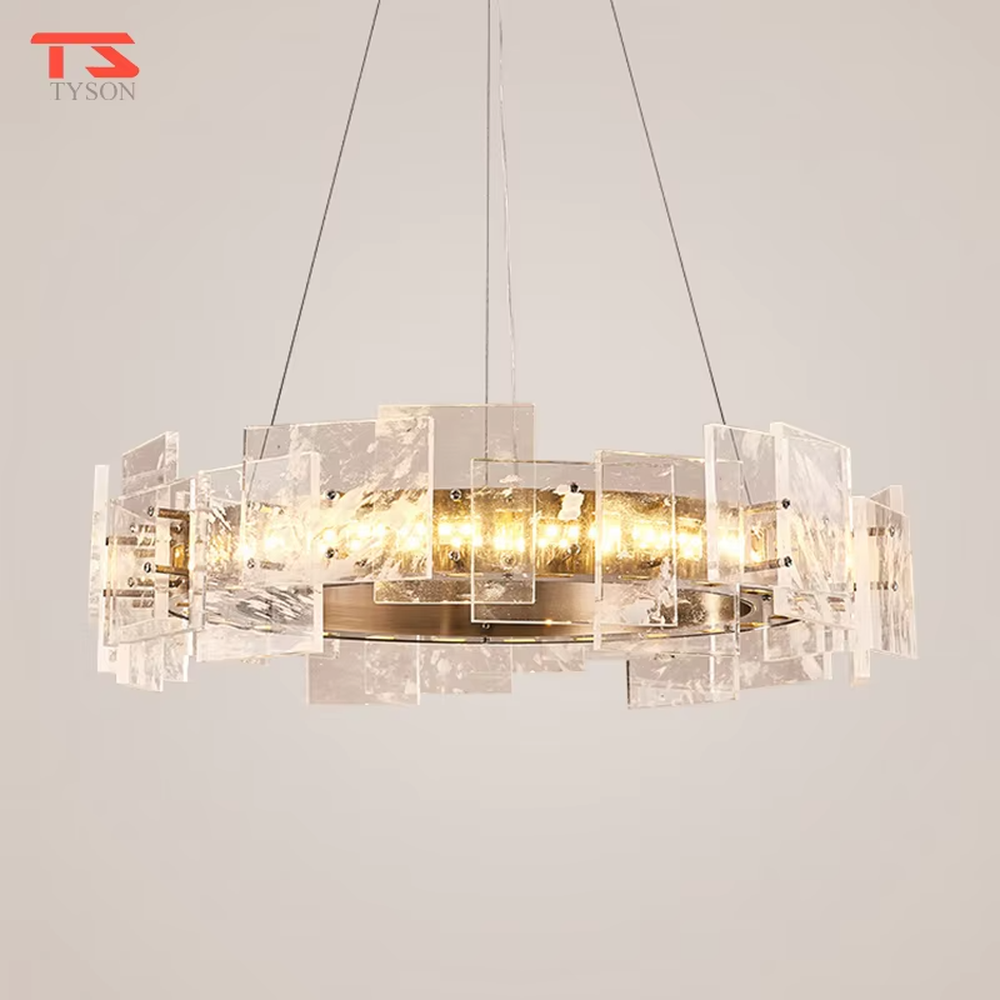 Modern light luxury ice crystal ring chandelier, featuring a gold metal frame paired with staggered ice-crystal textured acrylic panels. Light refracts through the panels to create a brilliant and soft glow, combining luxury texture and artistic ambiance, making it a high-end decorative lighting fixture that elevates the space's style.