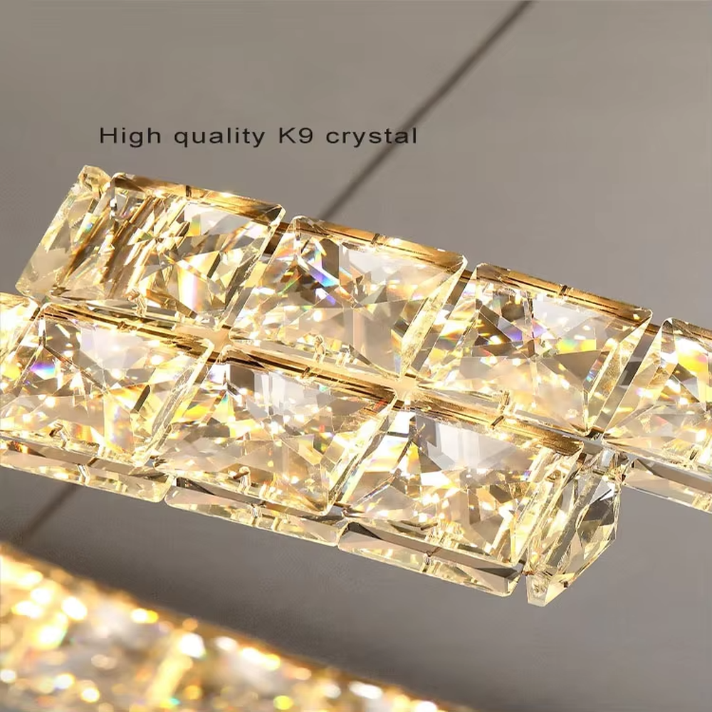 This modern light luxury double-ring interwoven crystal chandelier features a silver metal base, inlaid with transparent crystals to create a dynamic double-ring interwoven shape. When lit, light refracts through the crystal to emit a brilliant and dynamic glow, combining a futuristic feel with an ambient atmosphere. Ideal for living rooms, dining rooms, light luxury apartments, and other spaces, it adds an exquisite and sophisticated touch to modern minimalist or light luxury home environments.