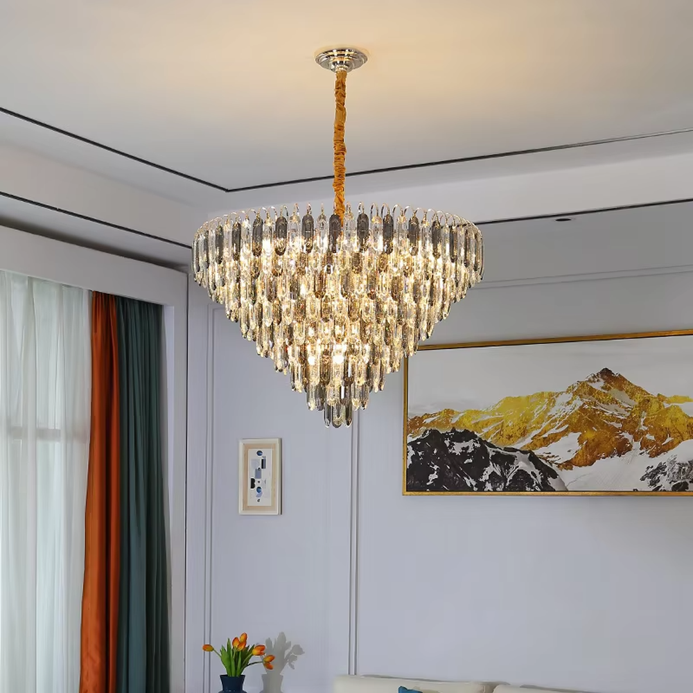 This modern light luxury layered crystal chandelier features a metal ceiling base, with multiple layers of transparent long crystal strips hanging down to form a full fan-shaped dome. When lit, light refracts through the crystal to emit a brilliant and luxurious glow, combining a luxurious texture with an ambient atmosphere. Ideal for living rooms, bedrooms, dining rooms, and other spaces, it adds an elegant and exquisite touch to modern light luxury or European luxury home environments.