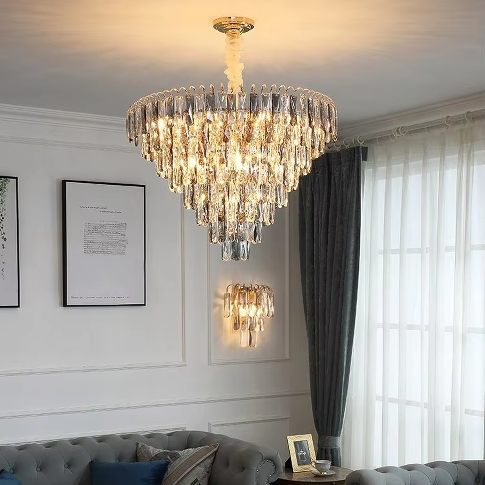 This modern light luxury layered crystal chandelier features a metal ceiling base, with multiple layers of transparent long crystal strips hanging down to form a full fan-shaped dome. When lit, light refracts through the crystal to emit a brilliant and luxurious glow, combining a luxurious texture with an ambient atmosphere. Ideal for living rooms, bedrooms, dining rooms, and other spaces, it adds an elegant and exquisite touch to modern light luxury or European luxury home environments.