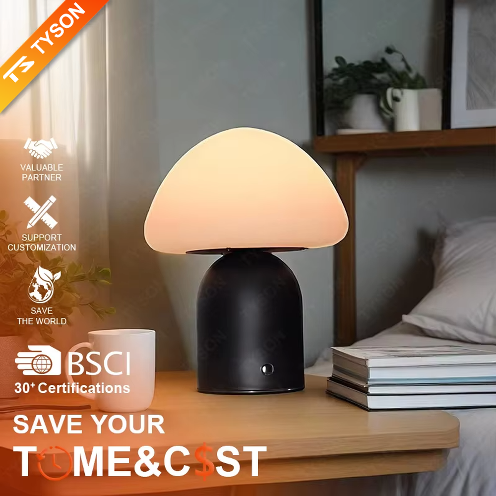 This is a minimalist mushroom-shaped table lamp with a white rounded mushroom lampshade and a simple base, featuring a fresh and cute design with a warm ambiance. It is used for local desktop lighting and decoration, creating a minimalist and warm atmosphere. It is suitable for Nordic-style home bedrooms, children's rooms, minimalist office spaces and other places.