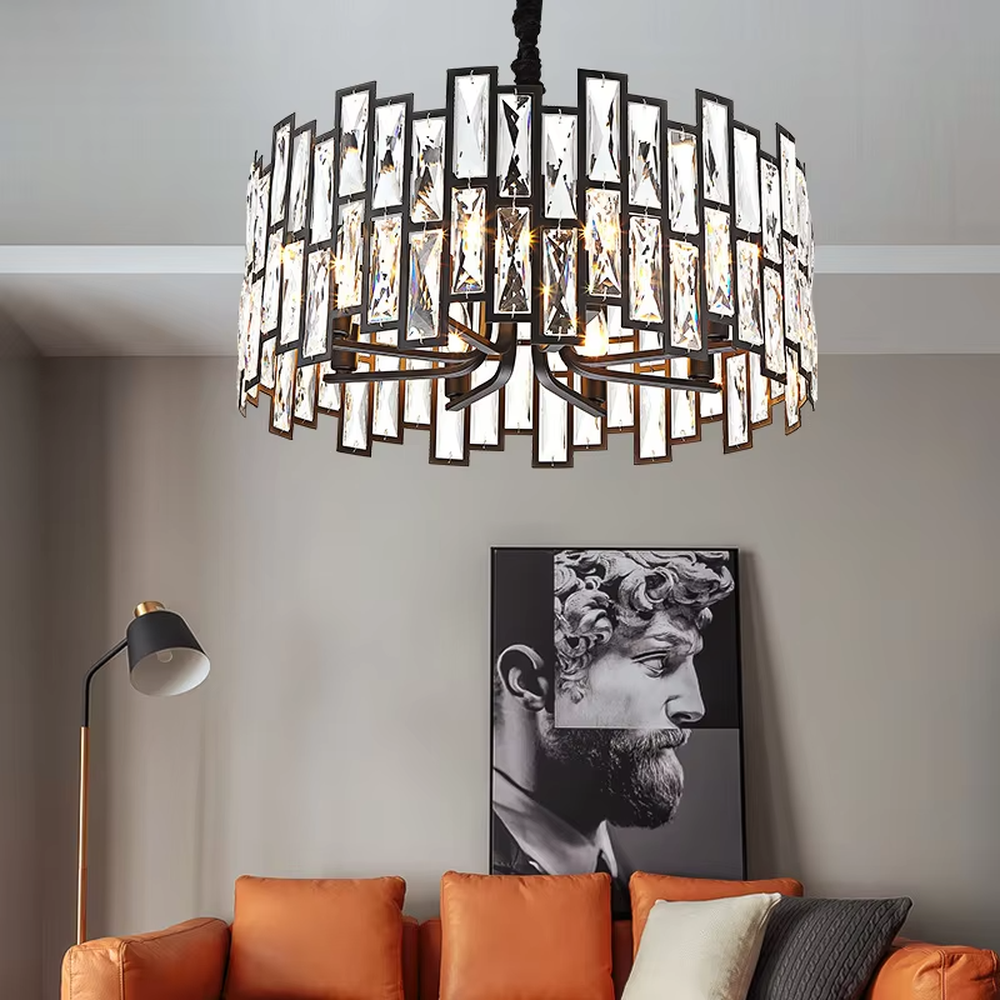 This modern light luxury square crystal chandelier features a black metal frame, inlaid with multi-faceted cut crystal pieces to form a square shape. When lit, light refracts through the crystal to emit a brilliant and luxurious glow, combining a bold texture with an elegant ambiance. Ideal for living rooms, dining rooms, large apartments, and other spaces, it adds an exquisite and sophisticated touch to modern minimalist or light luxury home environments.