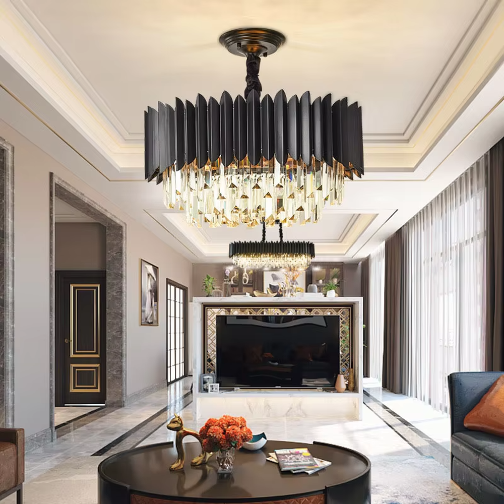 This modern light luxury two-layer chandelier features a dome shape enclosed by matte black vertical-textured metal on the upper layer, paired with transparent crystal tassel pendants on the lower layer, suspended by a black braided cord. When lit, light refracts through the crystal to emit a brilliant and soft glow, combining a sleek, bold texture with an elegant ambiance. Ideal for dining rooms, bedrooms, light luxury living rooms, and other spaces, it adds an exquisite and sophisticated touch to modern minimalist or industrial-style home environments.