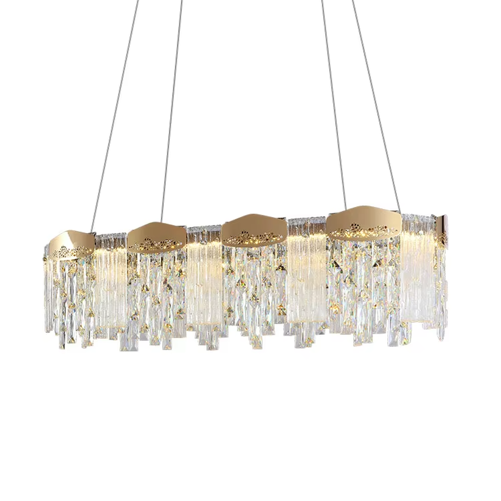 This modern light luxury linear crystal chandelier features a gold metal frame, with dense transparent long crystals hanging down and hollow-textured metal decorative blocks on top. When lit, light refracts through the crystal to emit a brilliant and soft glow, combining an exquisite texture with an ambient atmosphere. Ideal for dining rooms, bars, light luxury apartments, and other spaces, it adds an exquisite and sophisticated touch to modern minimalist or light luxury home environments.