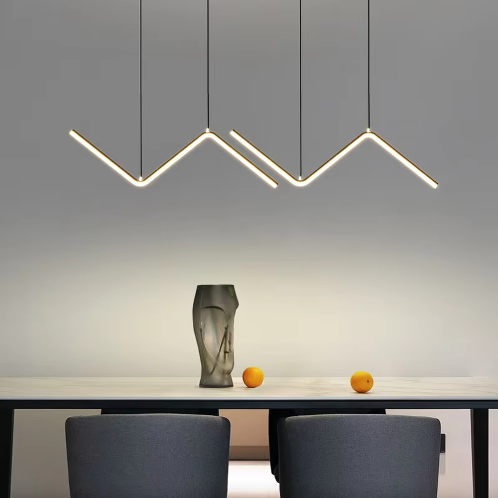 Modern minimalist mountain-shaped linear chandelier, featuring a gold metal frame paired with LED light strips to create staggered mountain contour lines. It emits soft and even light, combining design sense and ambiance, making it a decorative lighting fixture that elevates the space's style.
