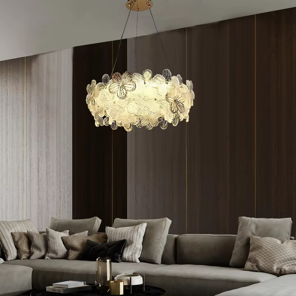 This modern light luxury linear petal chandelier features a full linear shape made of transparent petal-shaped glass slices. When lit, light refracts through the glass to emit a soft and brilliant glow, combining an ethereal texture with an ambient atmosphere. Ideal for dining rooms, bars, light luxury apartments, and other spaces, it adds a dreamy and exquisite touch to modern minimalist or French light luxury home environments.