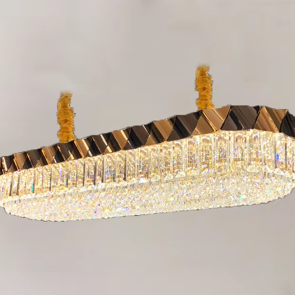 This modern light luxury two-layer circular crystal chandelier features a black-and-gold metal frame, inlaid with transparent long crystals to form a double-layered dome shape. The geometric black-and-gold metal contrasts brilliantly with the shimmering crystal, and when lit, light refracts through the crystal to emit a luxurious and soft glow, combining a sophisticated texture with an ambient atmosphere. Ideal for living rooms, dining rooms, light luxury apartments, and other spaces, it adds an exquisite and luxurious touch to modern minimalist or light luxury home environments.