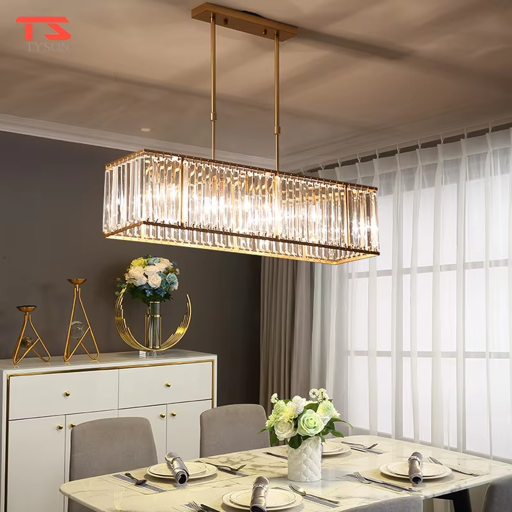 This modern light luxury linear crystal chandelier features a black metal frame, inlaid with transparent long crystals to form a rectangular shape, paired with height-adjustable black suspension wires. When lit, light refracts through the crystal to emit a brilliant and luxurious glow, combining a bold texture with an elegant ambiance. Ideal for dining rooms, bars, light luxury apartments, and other spaces, it adds an exquisite and sophisticated touch to modern minimalist or industrial-style home environments.