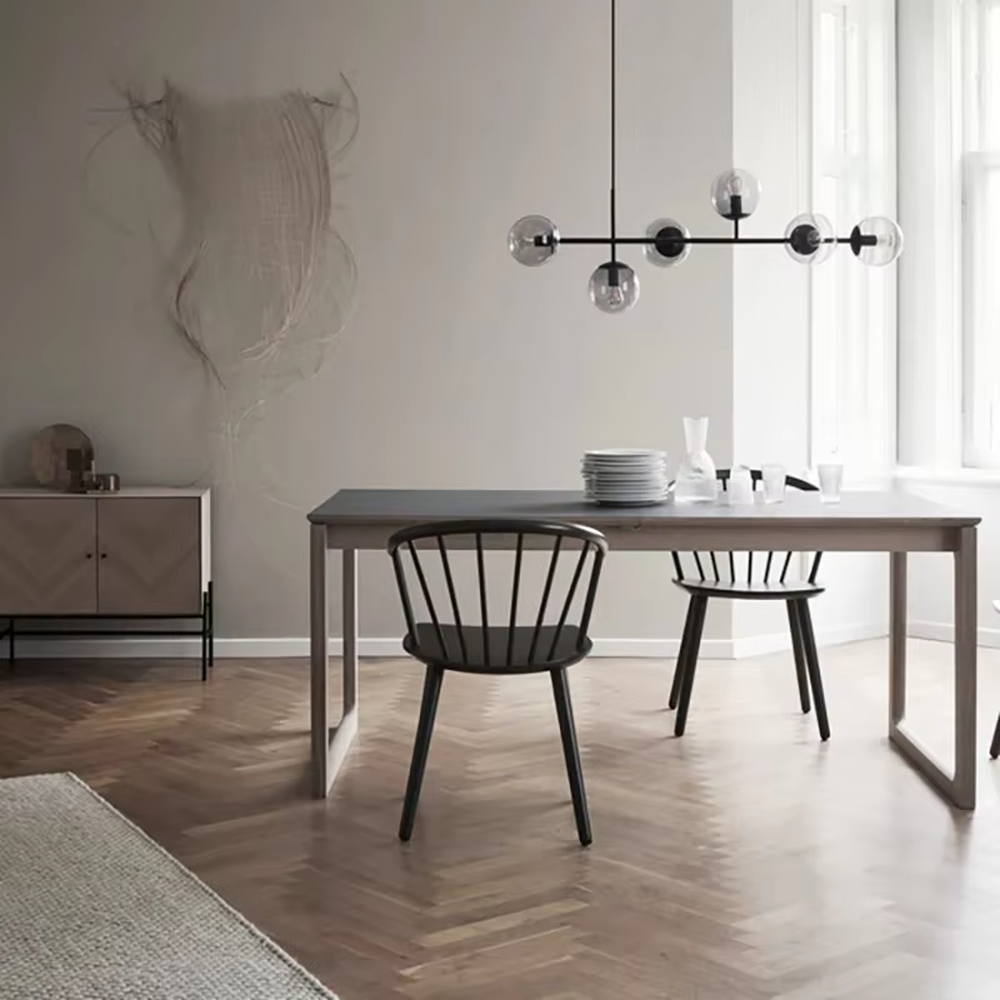 Modern light luxury molecular structure chandelier, featuring a linear brass metal frame paired with gradient smoky gray glass ball lampshades. Its minimalist and layered design combines style and ambiance, making it a decorative lighting fixture that elevates the space's aesthetic.
