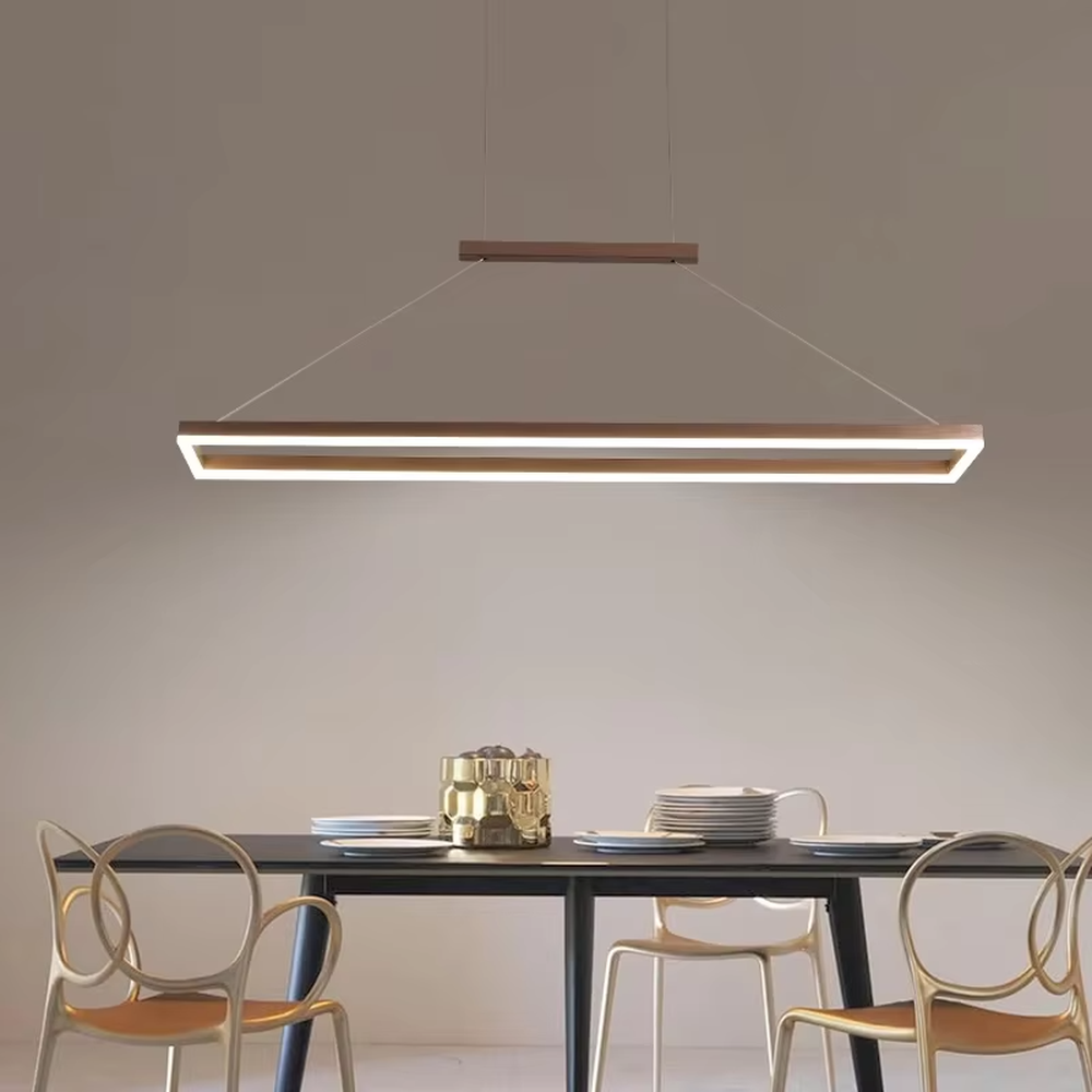 Modern minimalist wood-grain double-layer linear chandelier, featuring a double-layer rectangular frame made of wood-grain metal with built-in soft LED lighting. Its clean and elegant lines combine illumination and decoration, making it a modern home lighting fixture that enhances the space's texture.