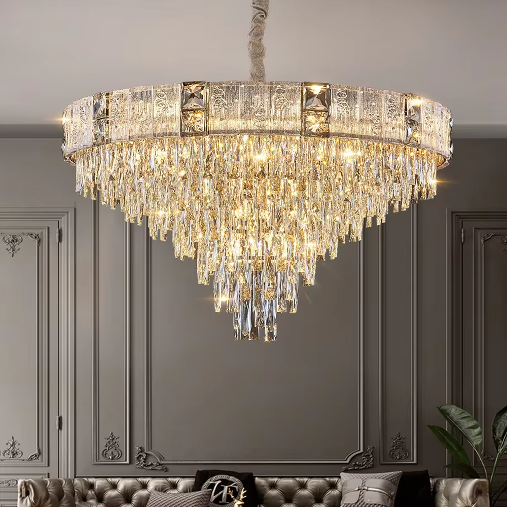 This light luxury and grand multi-layer conical crystal chandelier features a gold metal frame, with vertical-textured glass lampshades on the upper layer and multiple layers of transparent crystal tassels hanging below, creating a full conical shape. When lit, light refracts through the crystal to emit a brilliant and luxurious glow, combining elegant texture with an ambient atmosphere. Ideal for living rooms, dining rooms, villa high-ceiling spaces, and other areas, it adds an elegant and exquisite touch to European light luxury or modern luxury home environments.