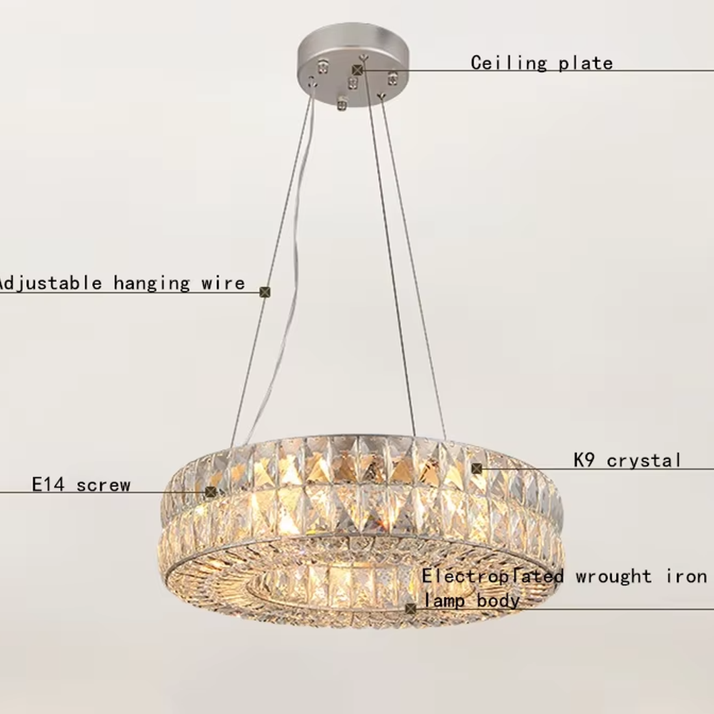 This modern light luxury linear crystal chandelier features a gold metal frame, inlaid with two layers of cut crystal blocks to form a square shape. When lit, light refracts through the crystals to emit a brilliant and luxurious glow, combining an exquisite texture with an ambient atmosphere. Ideal for dining rooms, bars, light luxury apartments, and other spaces, it adds an exquisite and sophisticated touch to modern minimalist or light luxury home environments.
