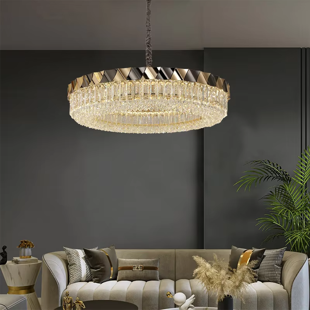 This modern light luxury two-layer circular crystal chandelier features a black-and-gold metal frame, inlaid with transparent long crystals to form a double-layered dome shape. The geometric black-and-gold metal contrasts brilliantly with the shimmering crystal, and when lit, light refracts through the crystal to emit a luxurious and soft glow, combining a sophisticated texture with an ambient atmosphere. Ideal for living rooms, dining rooms, light luxury apartments, and other spaces, it adds an exquisite and luxurious touch to modern minimalist or light luxury home environments.