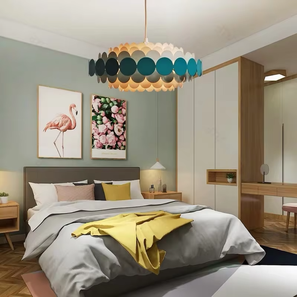 Nordic pop-style gradient disc chandelier, featuring an oval lampshade made of layered colorful discs with a gradient from light beige to deep teal. Light passes through the discs to create soft, gradient lighting effects, combining playfulness and artistry, making it a decorative lighting fixture that enhances space vitality.