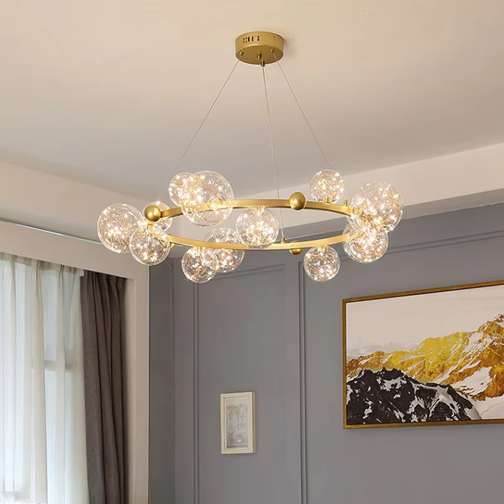 Modern light luxury starry sky ring chandelier, featuring a brass metal ring frame paired with transparent bubble glass balls with built-in lamp beads to form a star cluster shape. It emits bright and translucent light, combining a dreamy feel and elegant ambiance, making it a high-end decorative lighting fixture that elevates the space's style.