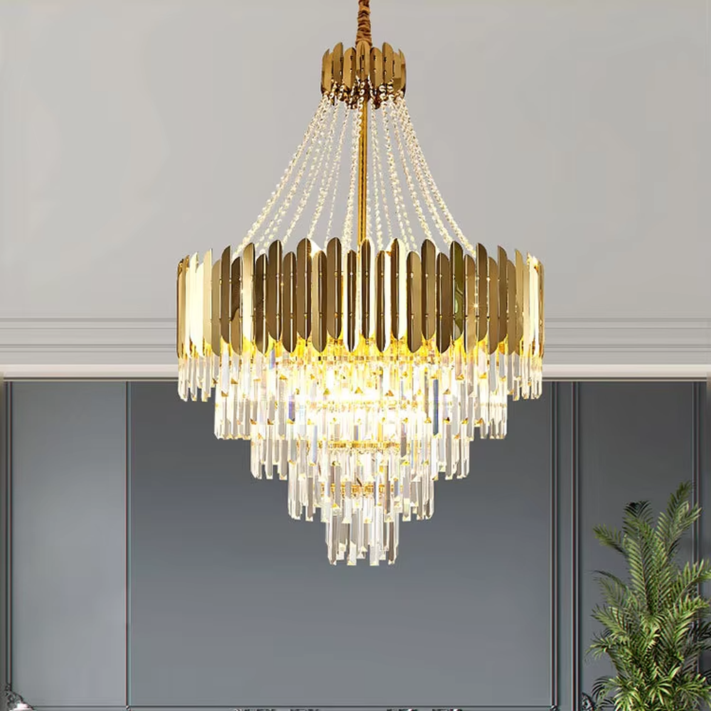 This light luxury and grand multi-layer crystal chandelier features a gold metal frame, paired with transparent crystal pendants and metal decorative pieces, creating a layered conical shape. When lit, light refracts through the crystal to emit a brilliant and luxurious glow, combining decorative appeal with an ambient atmosphere. Ideal for villa living rooms, high-ceiling spaces, hotel lobbies, or duplex foyers, it adds an elegant and exquisite touch to modern light luxury or European-style luxury spaces.