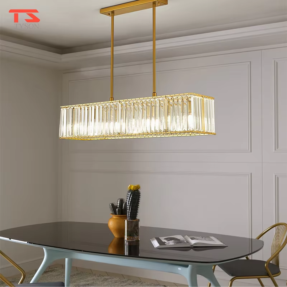 This modern light luxury linear crystal chandelier features a black metal frame, inlaid with transparent long crystals to form a rectangular shape, paired with height-adjustable black suspension wires. When lit, light refracts through the crystal to emit a brilliant and luxurious glow, combining a bold texture with an elegant ambiance. Ideal for dining rooms, bars, light luxury apartments, and other spaces, it adds an exquisite and sophisticated touch to modern minimalist or industrial-style home environments.