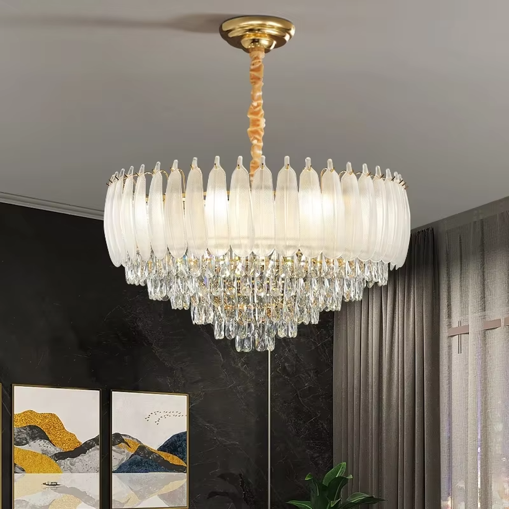This light luxury retro two-layer chandelier features a dome shape enclosed by vertical-textured frosted glass on the upper layer, paired with hanging crystal tassels on the lower layer, all set in a gold metal frame. When lit, light refracts through the glass and crystal to emit a soft and brilliant glow, combining elegant texture with an ambient atmosphere. Ideal for dining rooms, bedrooms, light luxury living rooms, and other spaces, it adds an elegant and exquisite touch to European retro or modern light luxury home environments.
