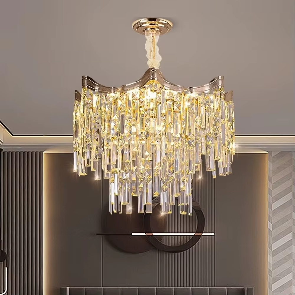 This European luxury fan-shaped crystal chandelier features a champagne gold metal frame, with dense long crystals hanging down to form a layered fan shape, suspended by a braided cord. When lit, light refracts through the crystal to emit a brilliant and luxurious glow, combining a luxurious texture with an ambient atmosphere. Ideal for villa living rooms, luxury dining rooms, high-end clubs, and other spaces, it adds an elegant and exquisite touch to European luxury or modern light luxury environments.
