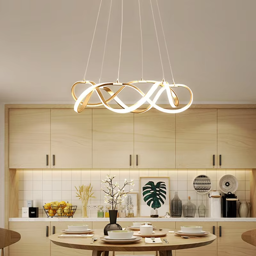 Modern art ribbon chandelier, featuring interwoven and flowing gold metal strips with built-in soft LED lighting. Its dynamic and layered lines combine artistry and ambiance, making it a high-end decorative lighting fixture that elevates the space's style.
